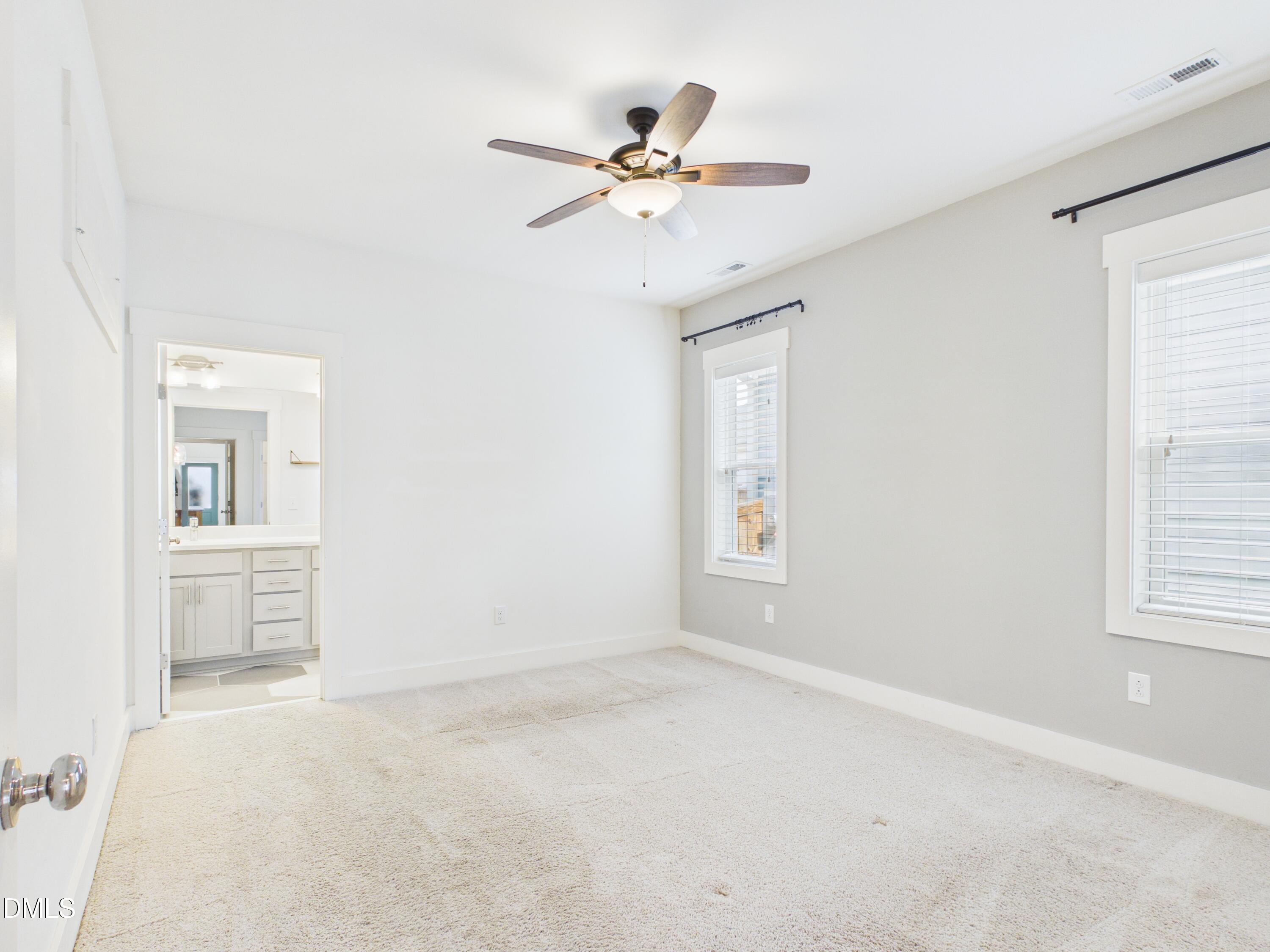 748 Groveview Wendell, NC 27591 - Photo 15 of 38 an empty room with a ceiling fan and window