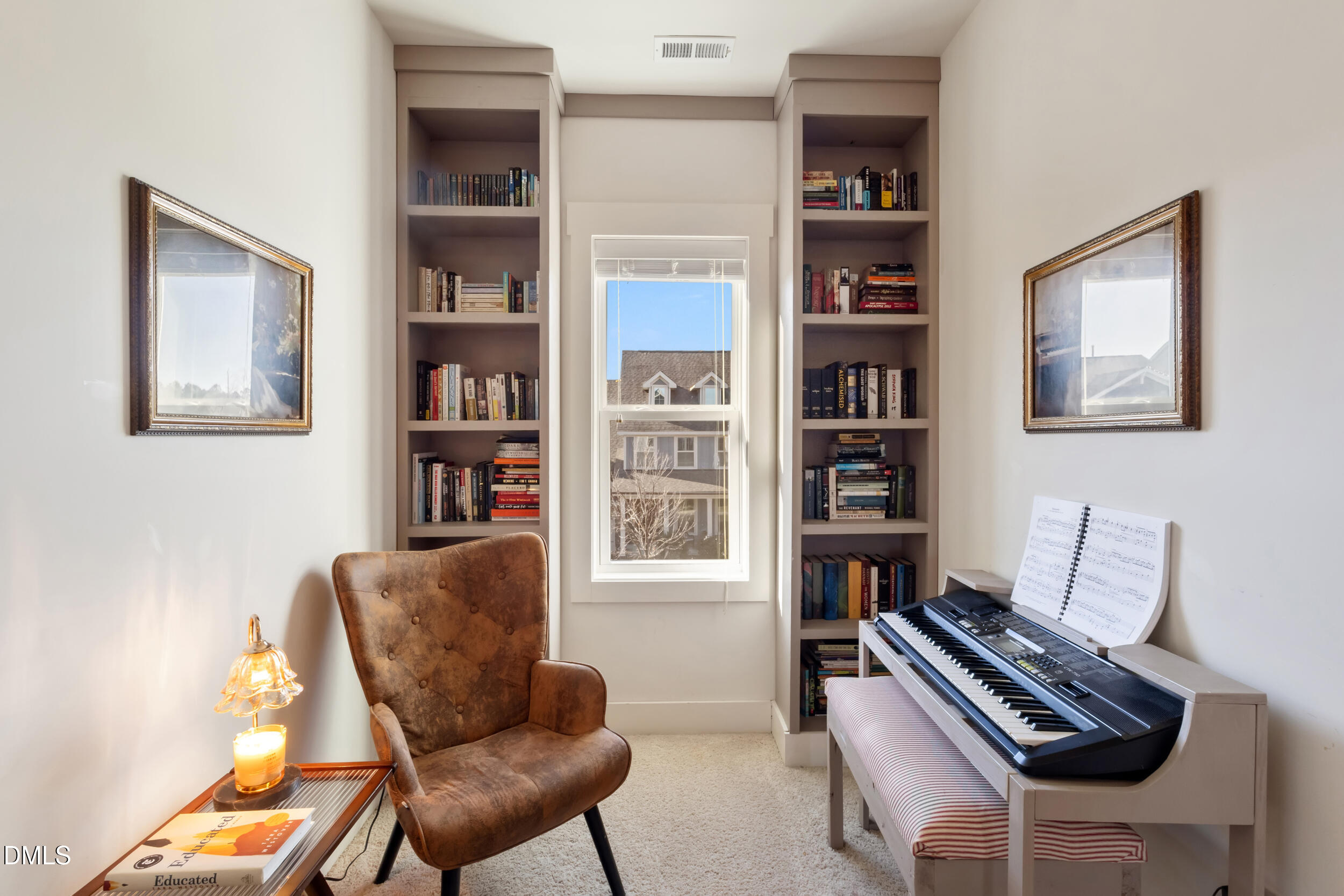 748 Groveview Wendell, NC 27591 - Photo 19 of 38 a living room with furniture and a book shelf