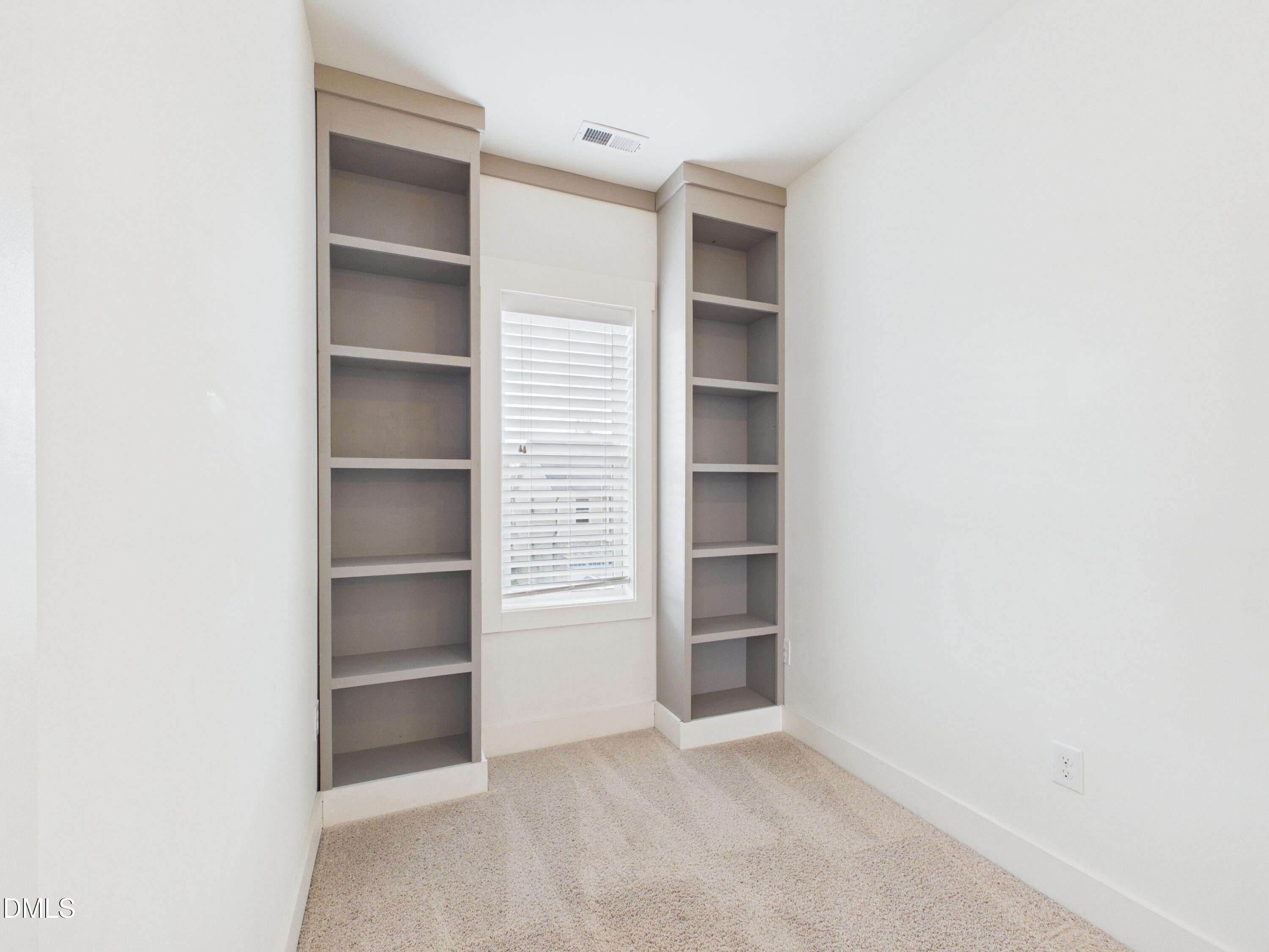 748 Groveview Wendell, NC 27591 - Photo 20 of 38 an empty room with shelves