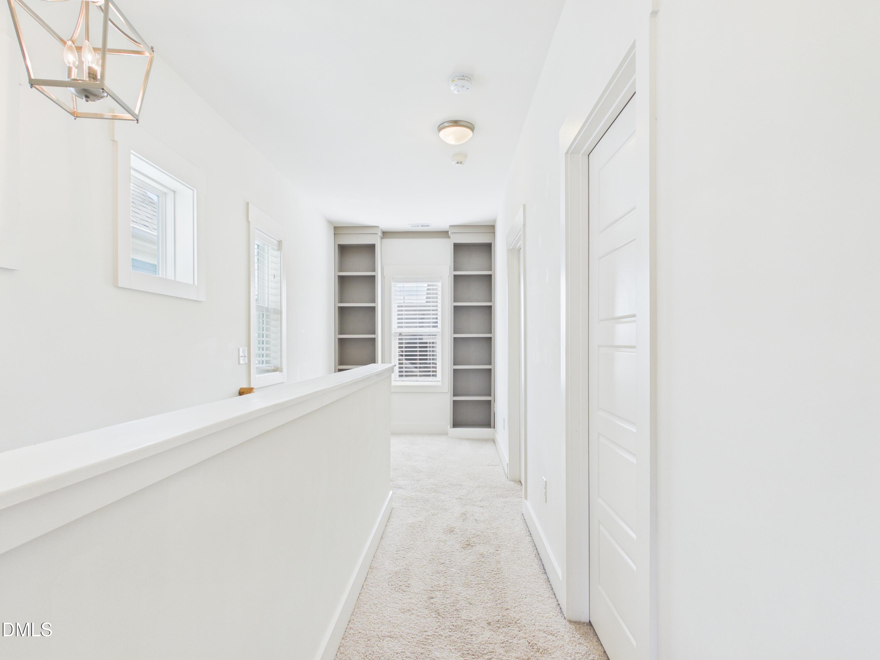 748 Groveview Wendell, NC 27591 - Photo 21 of 38 a view of a hallway with wooden floor and entryway