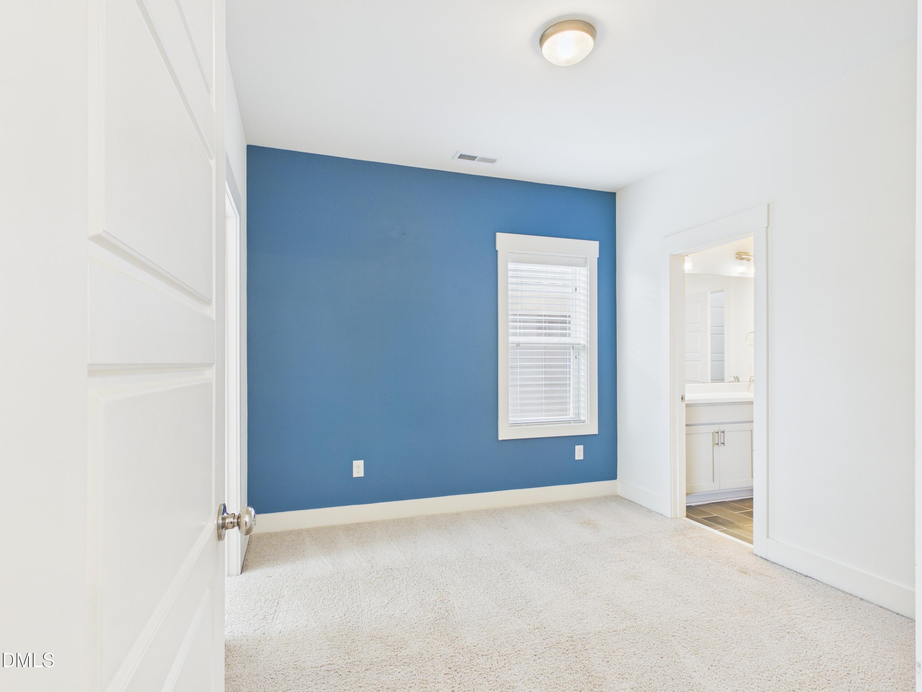 748 Groveview Wendell, NC 27591 - Photo 24 of 38 an empty room with windows and closet