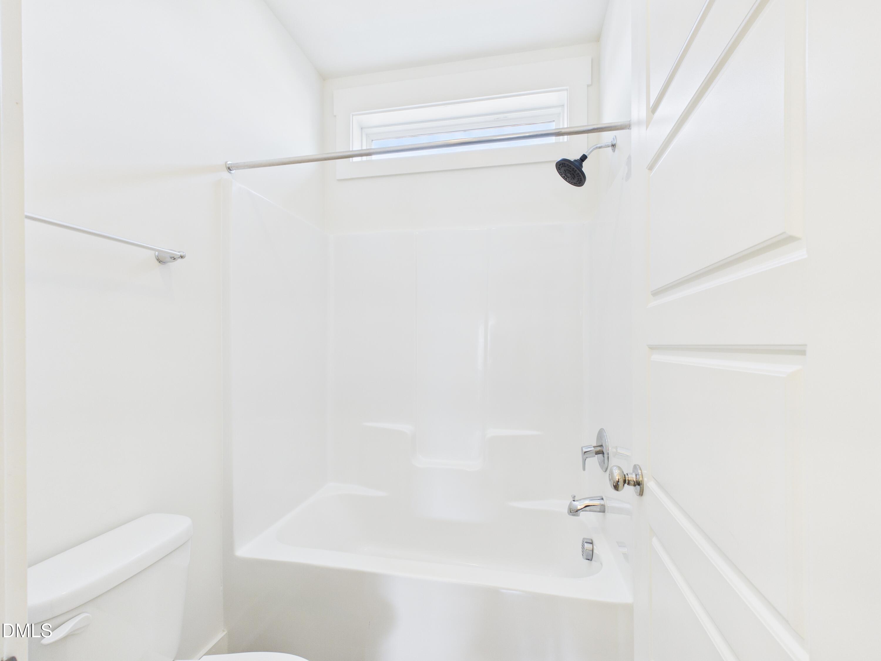 748 Groveview Wendell, NC 27591 - Photo 29 of 38 a bathroom with a bathtub and a toilet