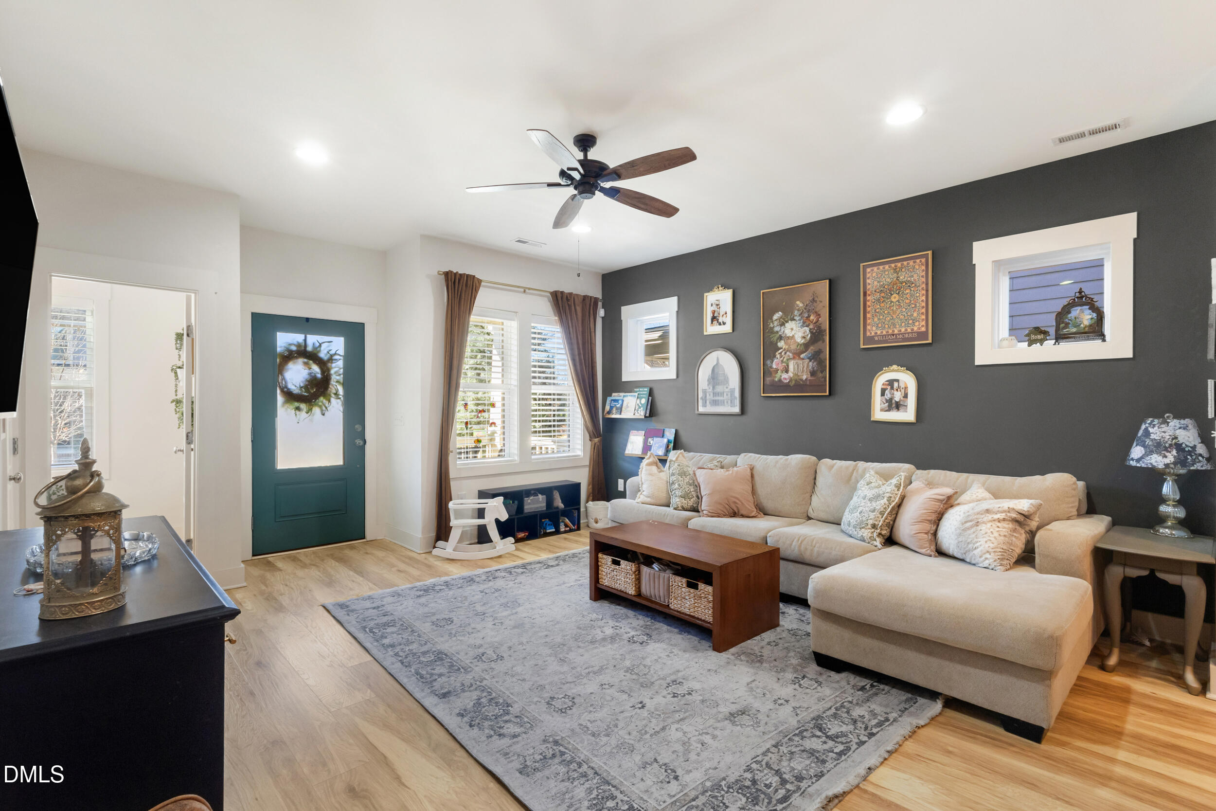 748 Groveview Wendell, NC 27591 - Photo 4 of 38 a living room with furniture and a flat screen tv