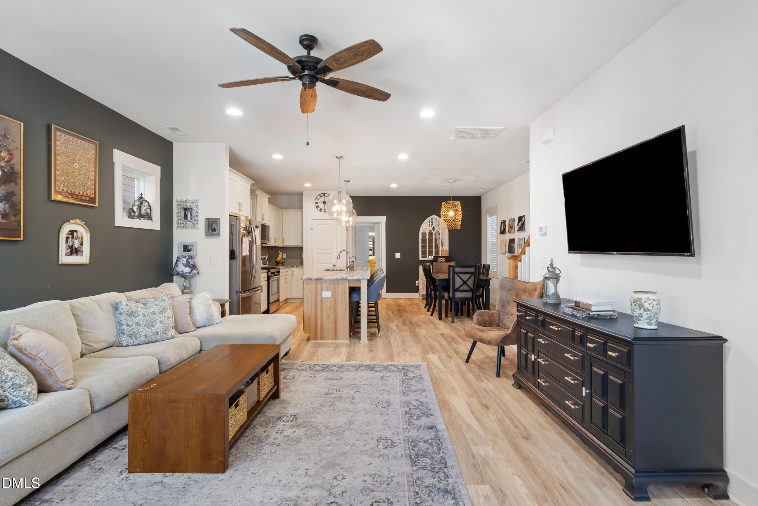 748 Groveview Wendell, NC 27591 - Photo 5 of 38 a living room with furniture and a flat screen tv