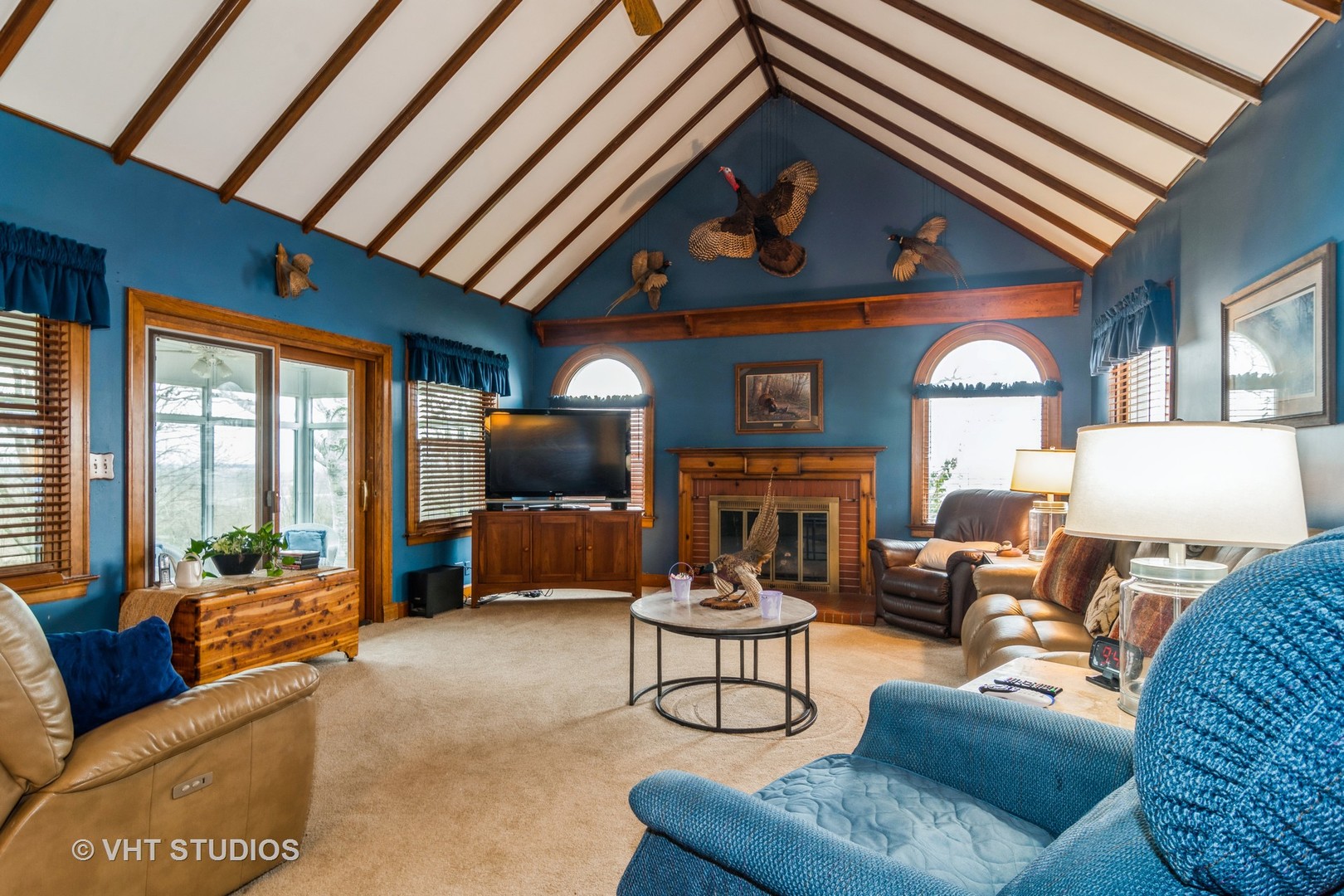 45W616 Keslinger Road Maple Park, IL 60151 - Photo 12 of 36 a living room with furniture a fireplace and a large window
