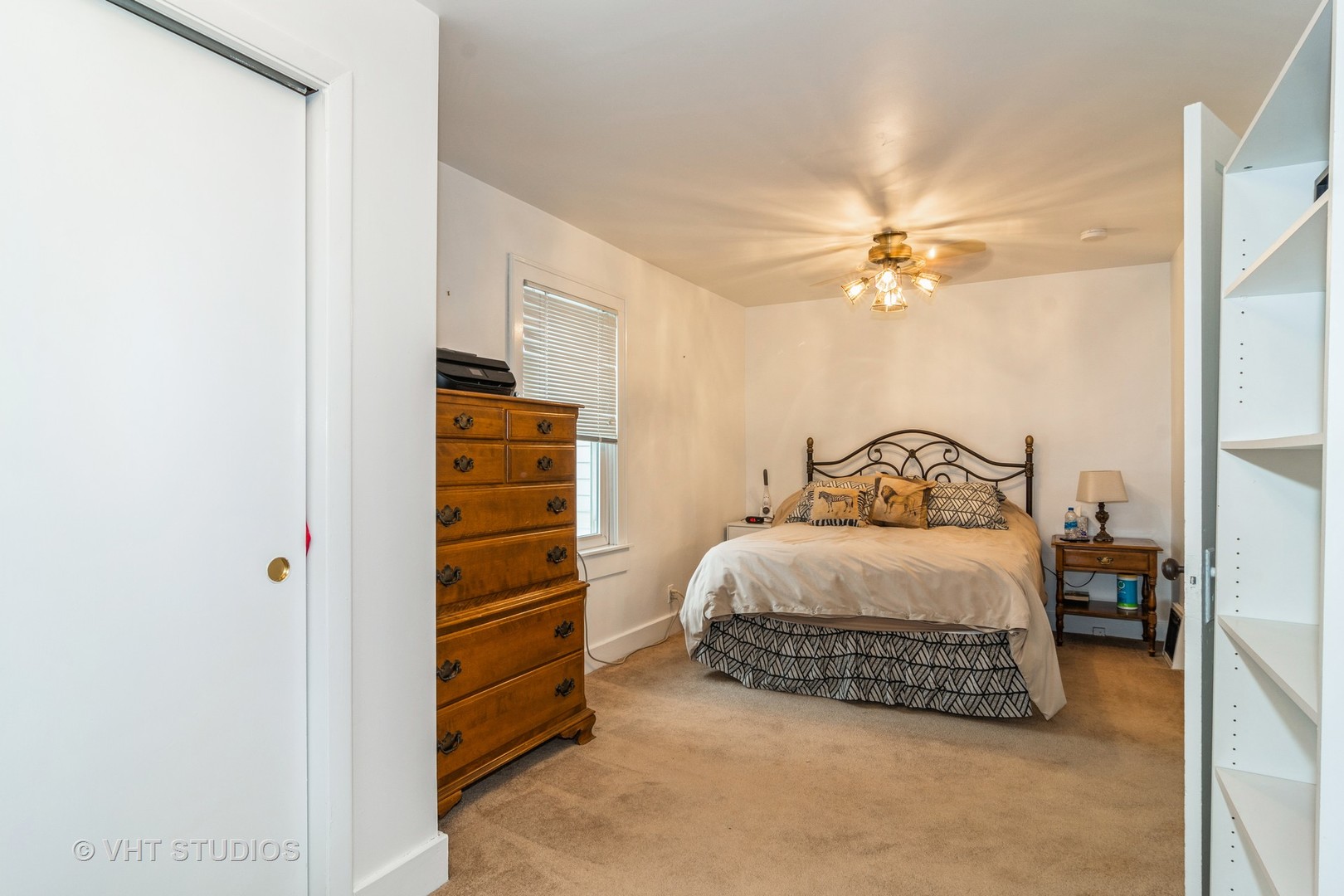 45W616 Keslinger Road Maple Park, IL 60151 - Photo 23 of 36 a bedroom with a bed and a ceiling fan