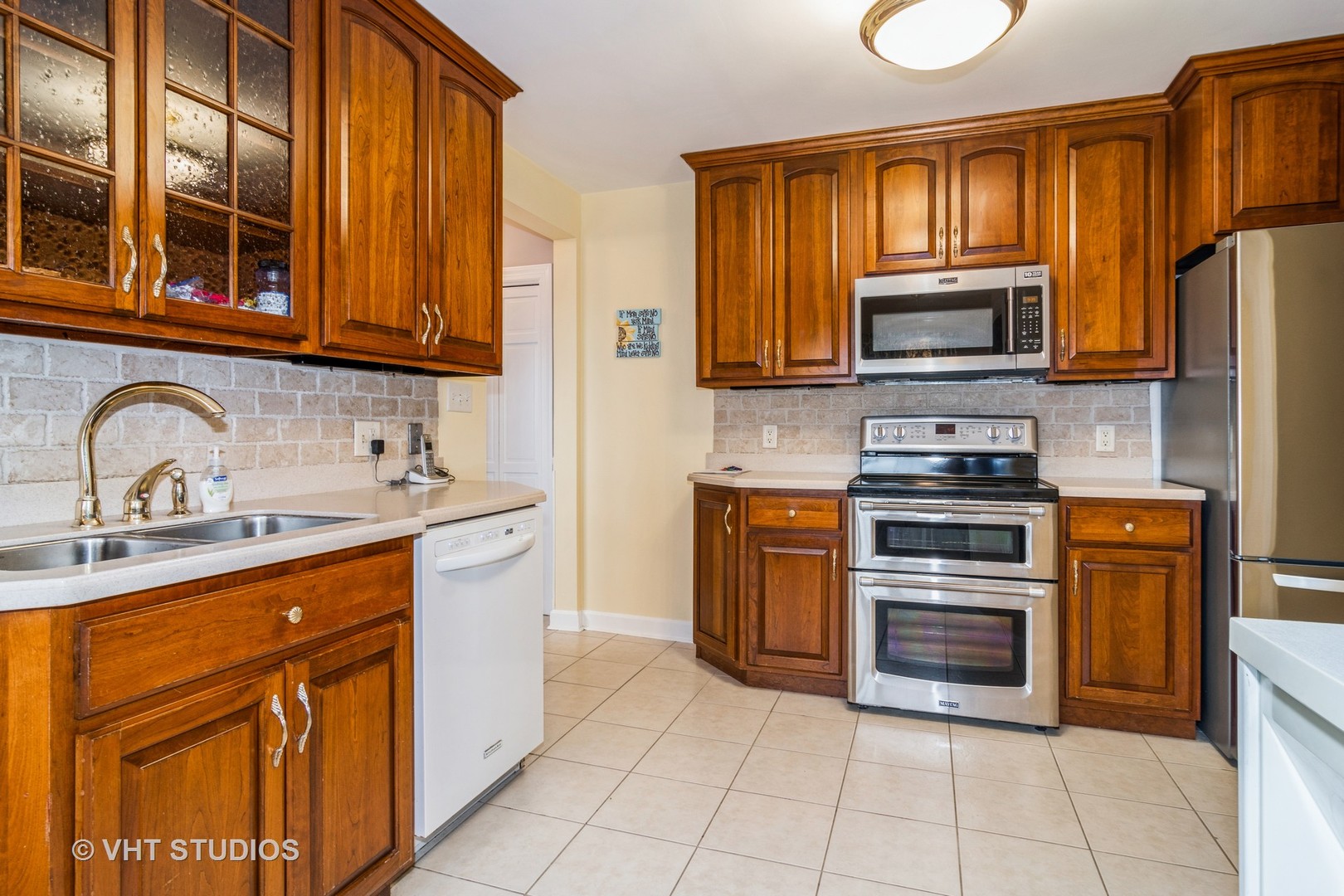 45W616 Keslinger Road Maple Park, IL 60151 - Photo 9 of 36 a kitchen with stainless steel appliances granite countertop a stove microwave and sink