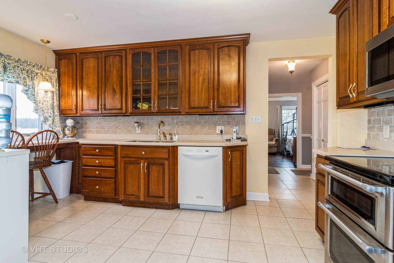 45W616 Keslinger Road Maple Park, IL 60151 - Photo 10 of 36 a kitchen with stainless steel appliances granite countertop a stove and a sink