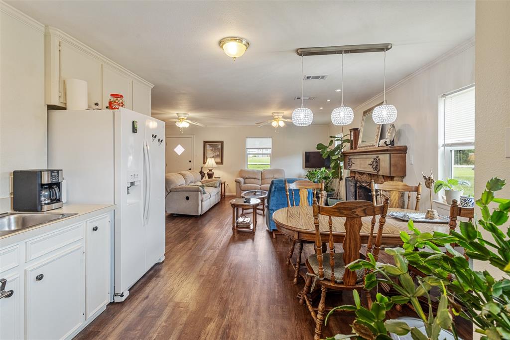 713 Midway Road Tool, TX 75143 - Photo 6 of 28 a very nice looking dining room with a large window and stainless steel appliances