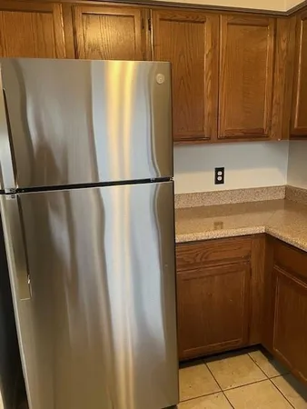 a white refrigerator freezer sitting in a kitchen