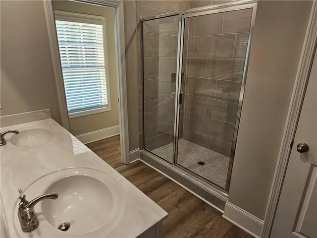 a bathroom with a sink and a shower
