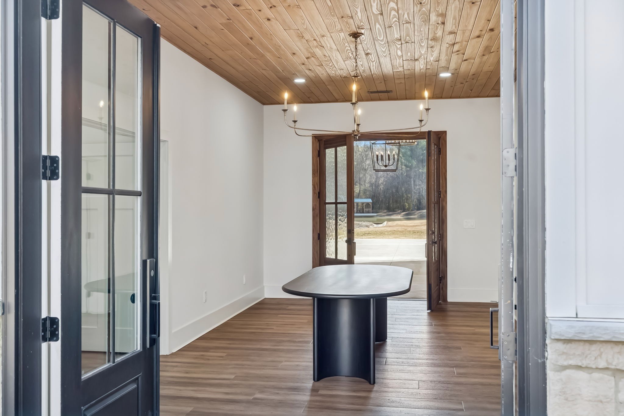 3400 Allsboro Road Cherokee, AL 35616 - Photo 16 of 100 a view of a hallway with wooden floor and a refrigerator