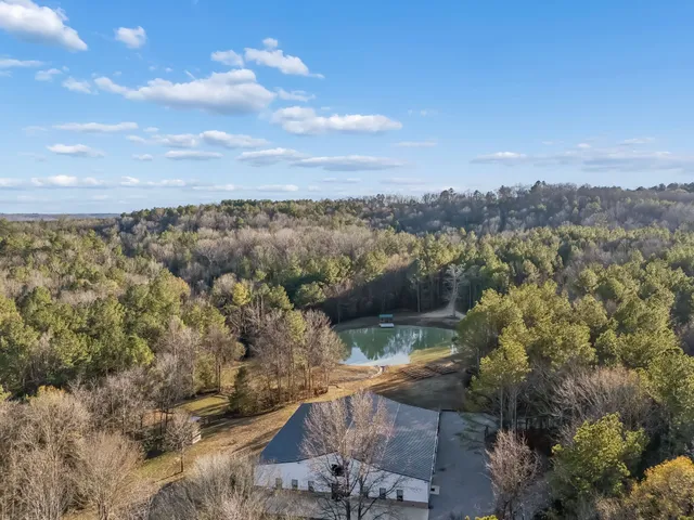 a view of a patio with table and chairs and potted plants