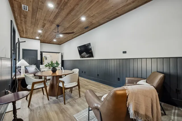 a kitchen with stainless steel appliances granite countertop a sink a stove and a refrigerator