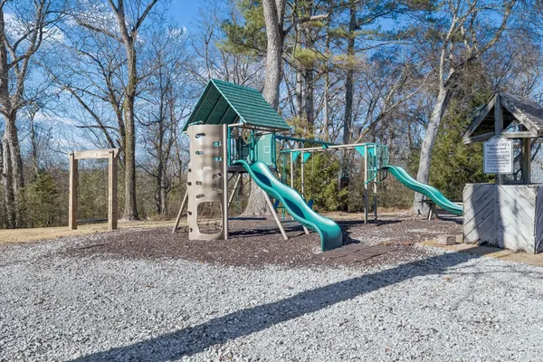 a view of outdoor space with trees all around