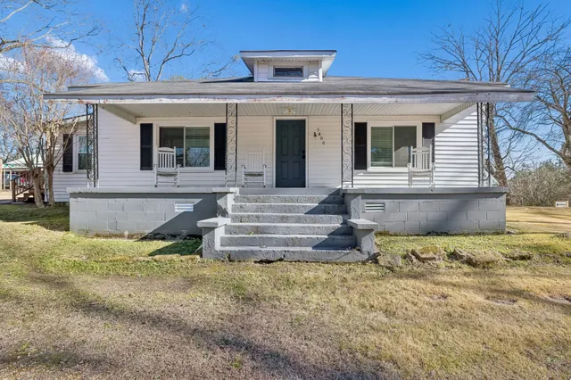 a backyard of a house with lots of green space
