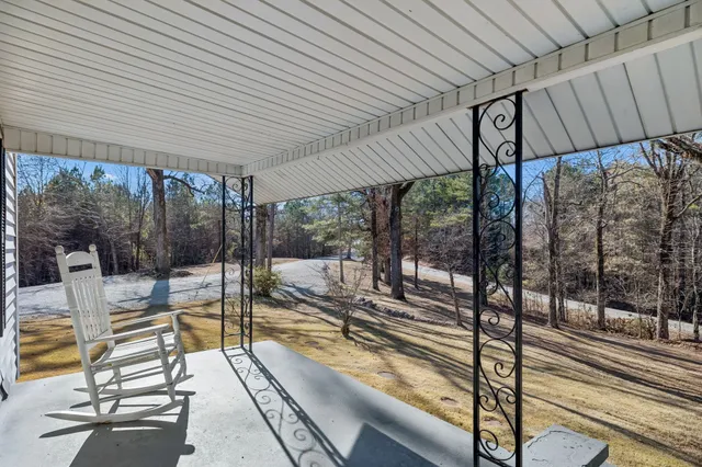 a view of a lake with houses in the back