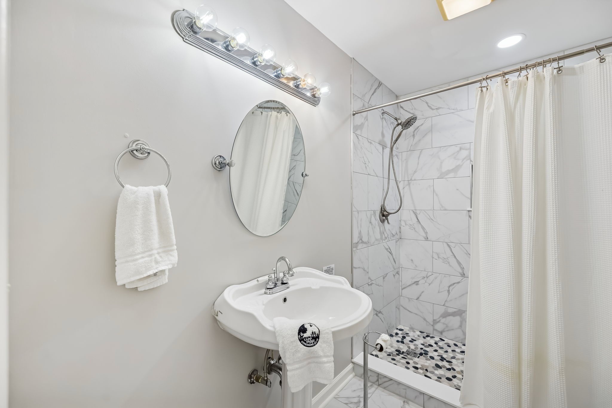 3400 Allsboro Road Cherokee, AL 35616 - Photo 64 of 100 a bathroom with a sink a mirror a vanity and a shower