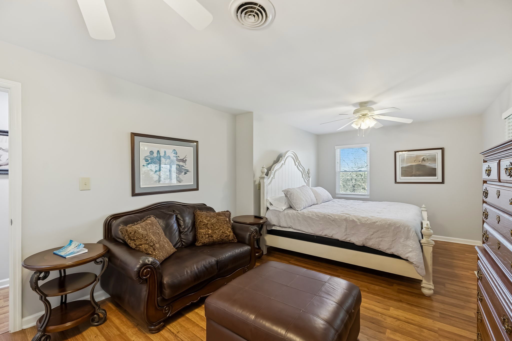 3400 Allsboro Road Cherokee, AL 35616 - Photo 66 of 100 a spacious bedroom with a bed and a chandelier