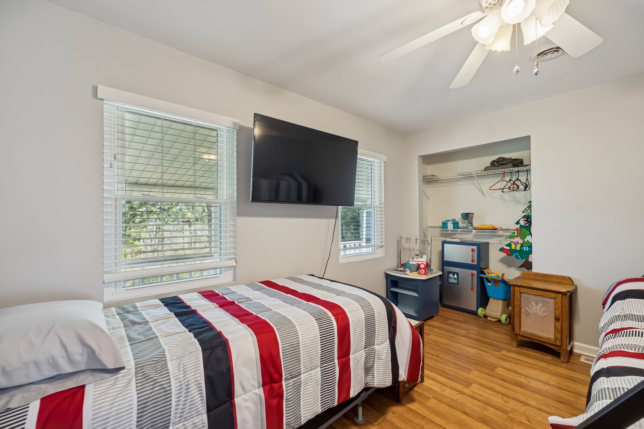 3400 Allsboro Road Cherokee, AL 35616 - Photo 67 of 100 a bedroom with a bed a flat screen tv and a chandelier