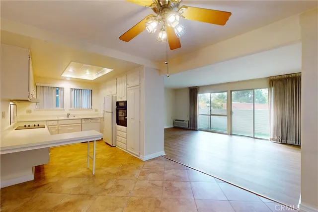 a view of a kitchen with a stove and cabinets