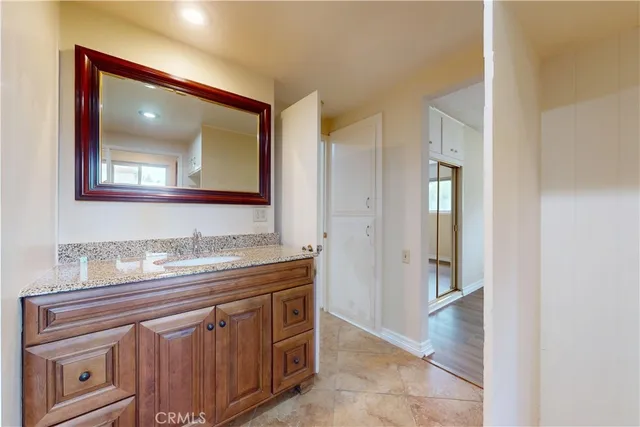 a view of walk in closet with empty room