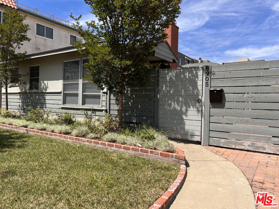 8903 Ramsgate Avenue Los Angeles, CA 90045 - Photo 1 of 15 a front view of a house with a yard