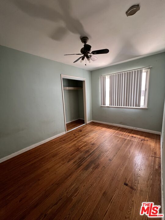 8903 Ramsgate Avenue Los Angeles, CA 90045 - Photo 11 of 15 a view of an empty room with wooden floor and a window