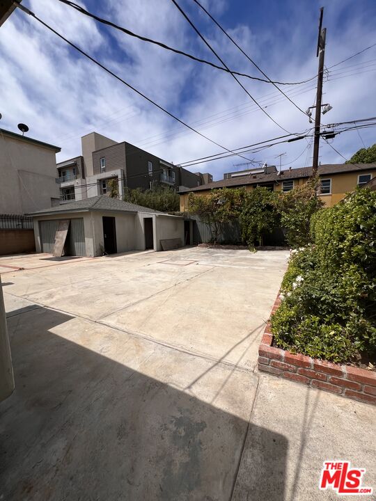 8903 Ramsgate Avenue Los Angeles, CA 90045 - Photo 12 of 15 a view of a swimming pool with a yard