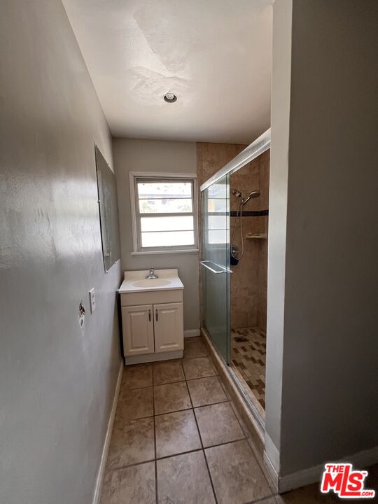 8903 Ramsgate Avenue Los Angeles, CA 90045 - Photo 10 of 15 a bathroom with a sink a toilet and shower