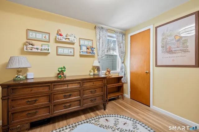 a room with furniture and paintings on the wall