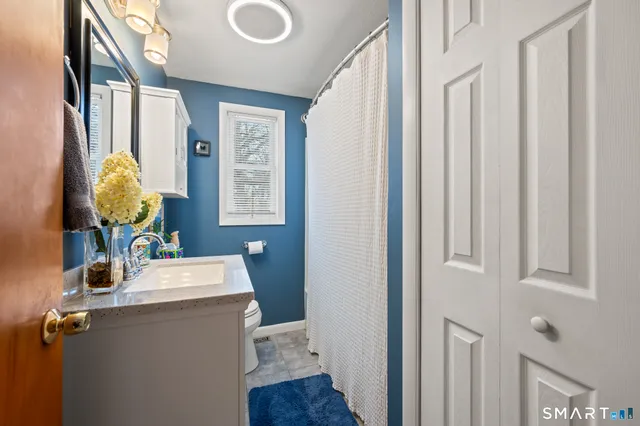 a room with a chair and wooden floor