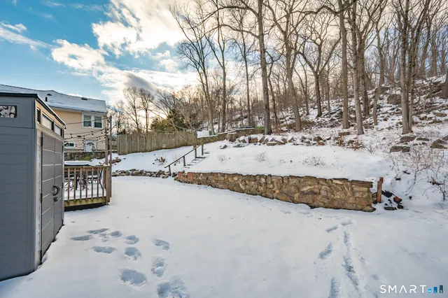 a view of a yard covered in snow