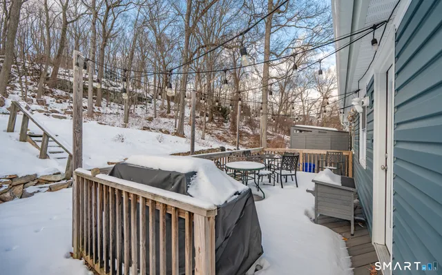 a terrace with outdoor seating and city view