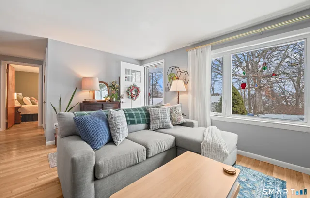 a living room with furniture and a window