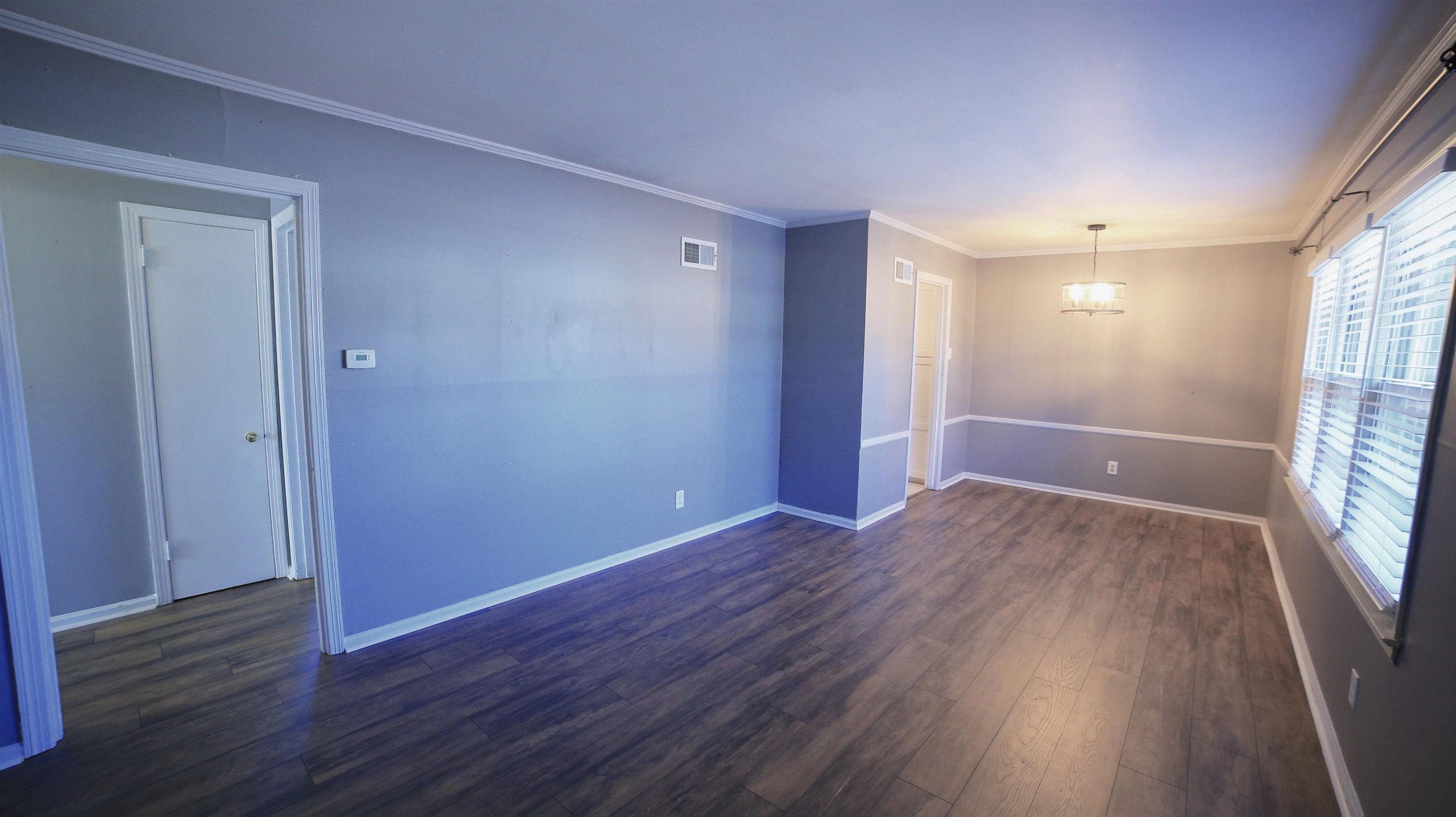 1605 Marcia Road Memphis, TN 38117 - Photo 4 of 15 wooden floor in an empty room with a window