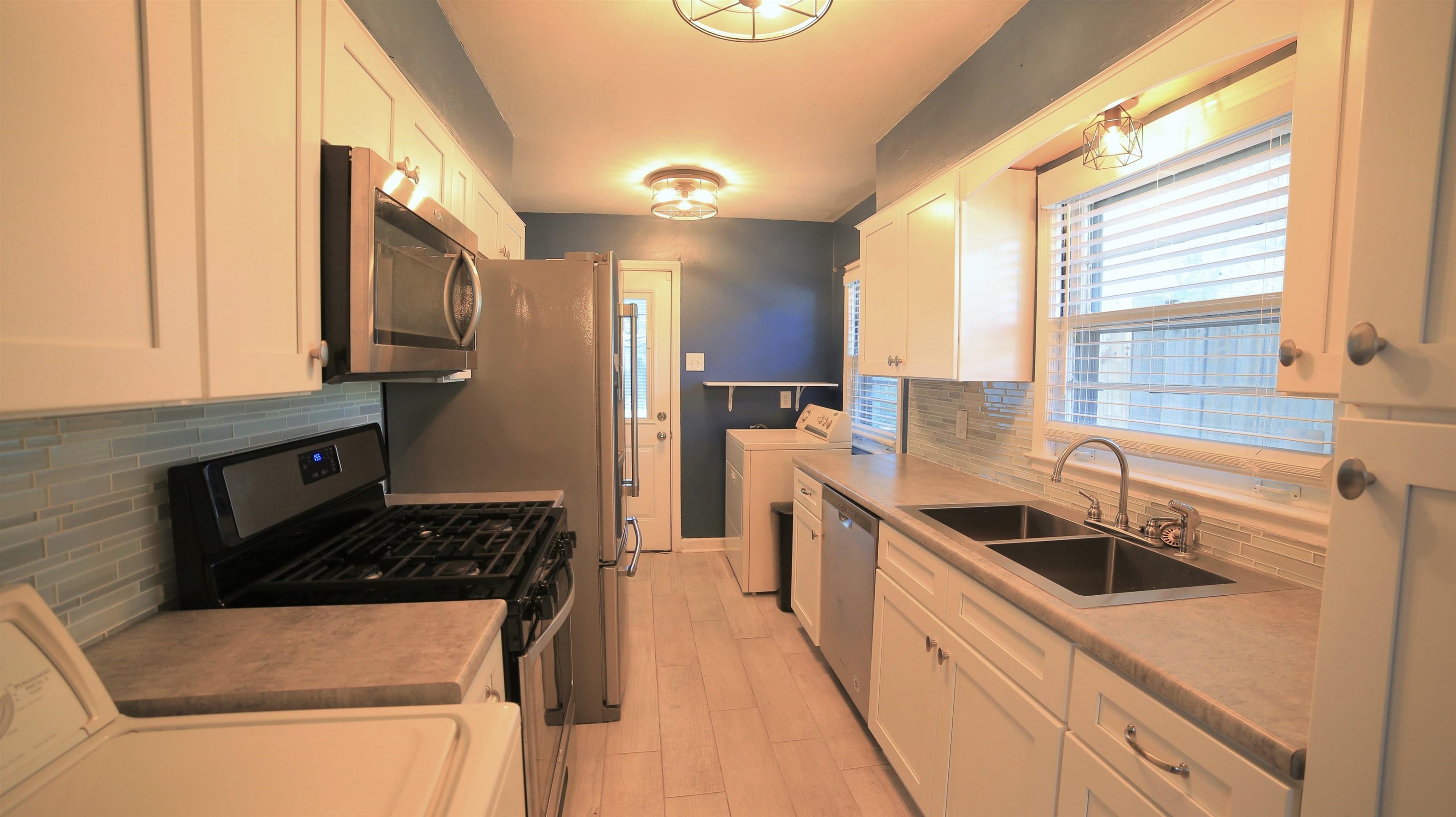 1605 Marcia Road Memphis, TN 38117 - Photo 5 of 15 a kitchen that has a sink and a stove