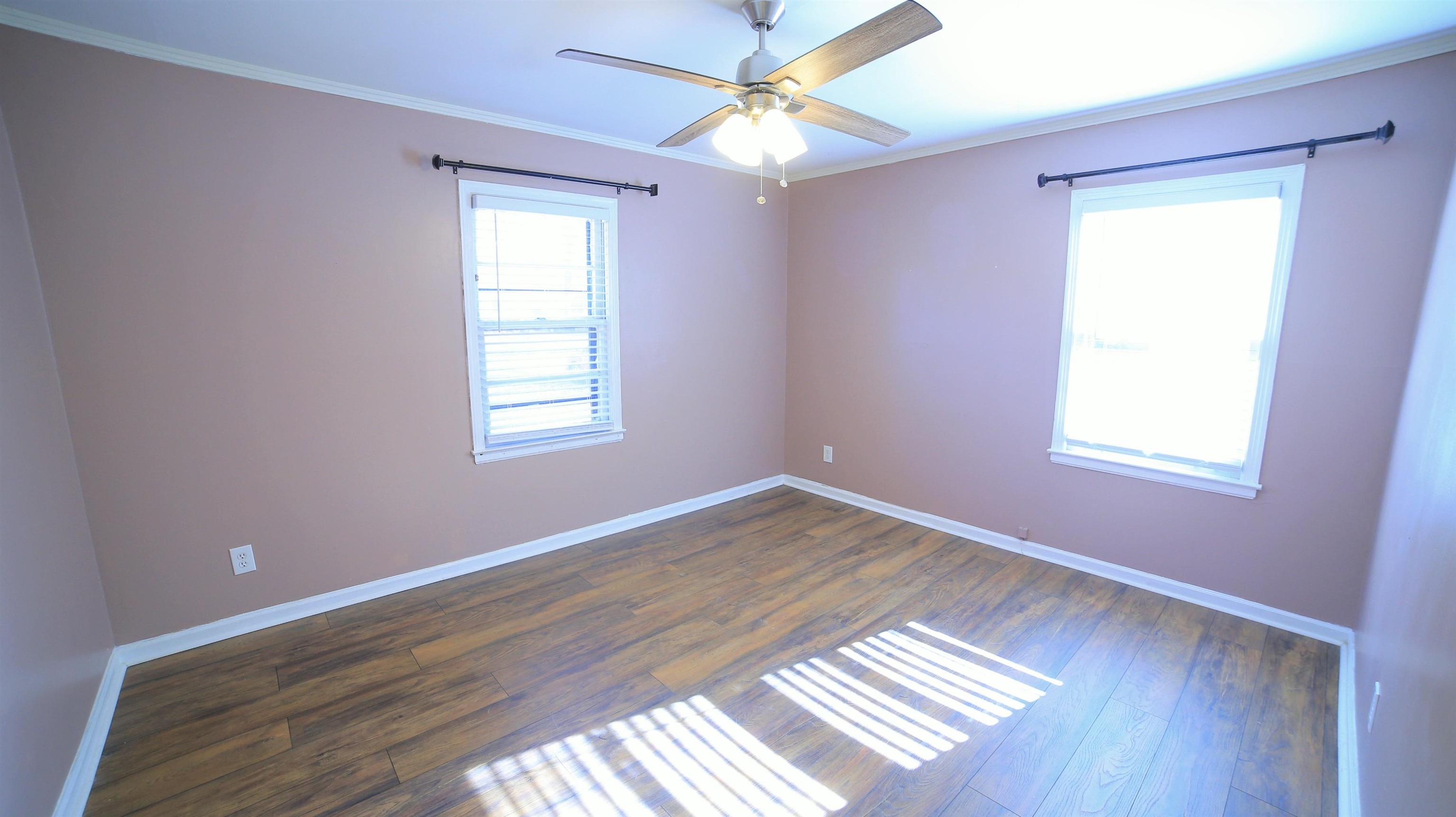 1605 Marcia Road Memphis, TN 38117 - Photo 8 of 15 a view of an empty room with wooden floor and a window