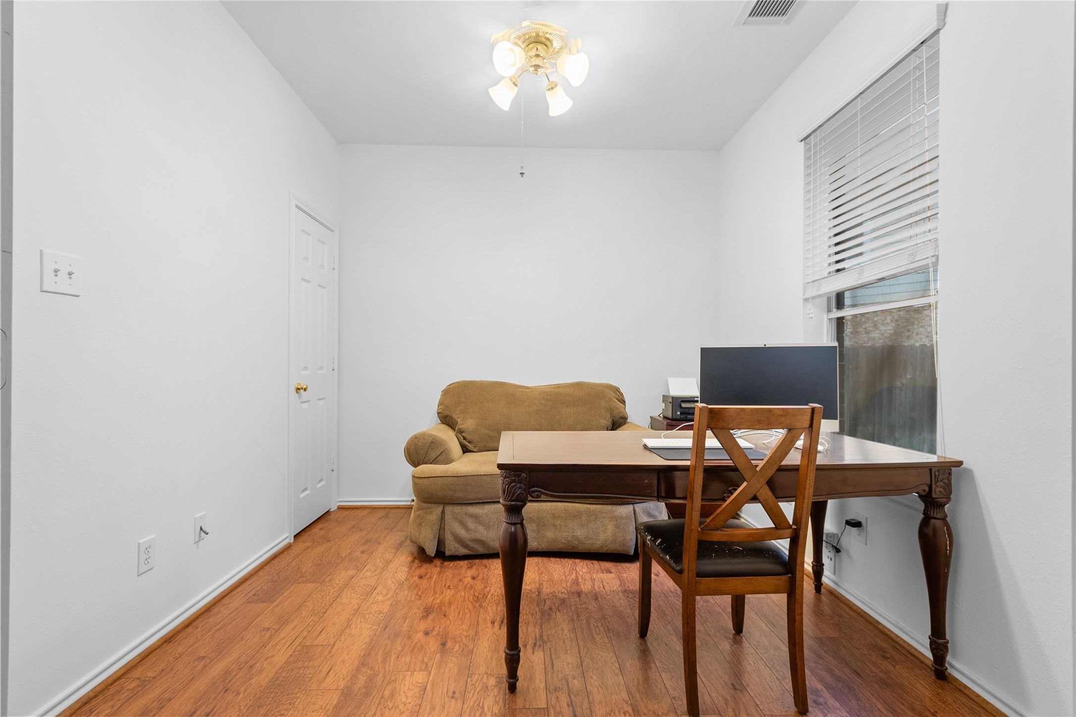 21014 Jessica Rose Lane Spring, TX 77379 - Photo 14 of 30 a workspace with furniture and wooden floor