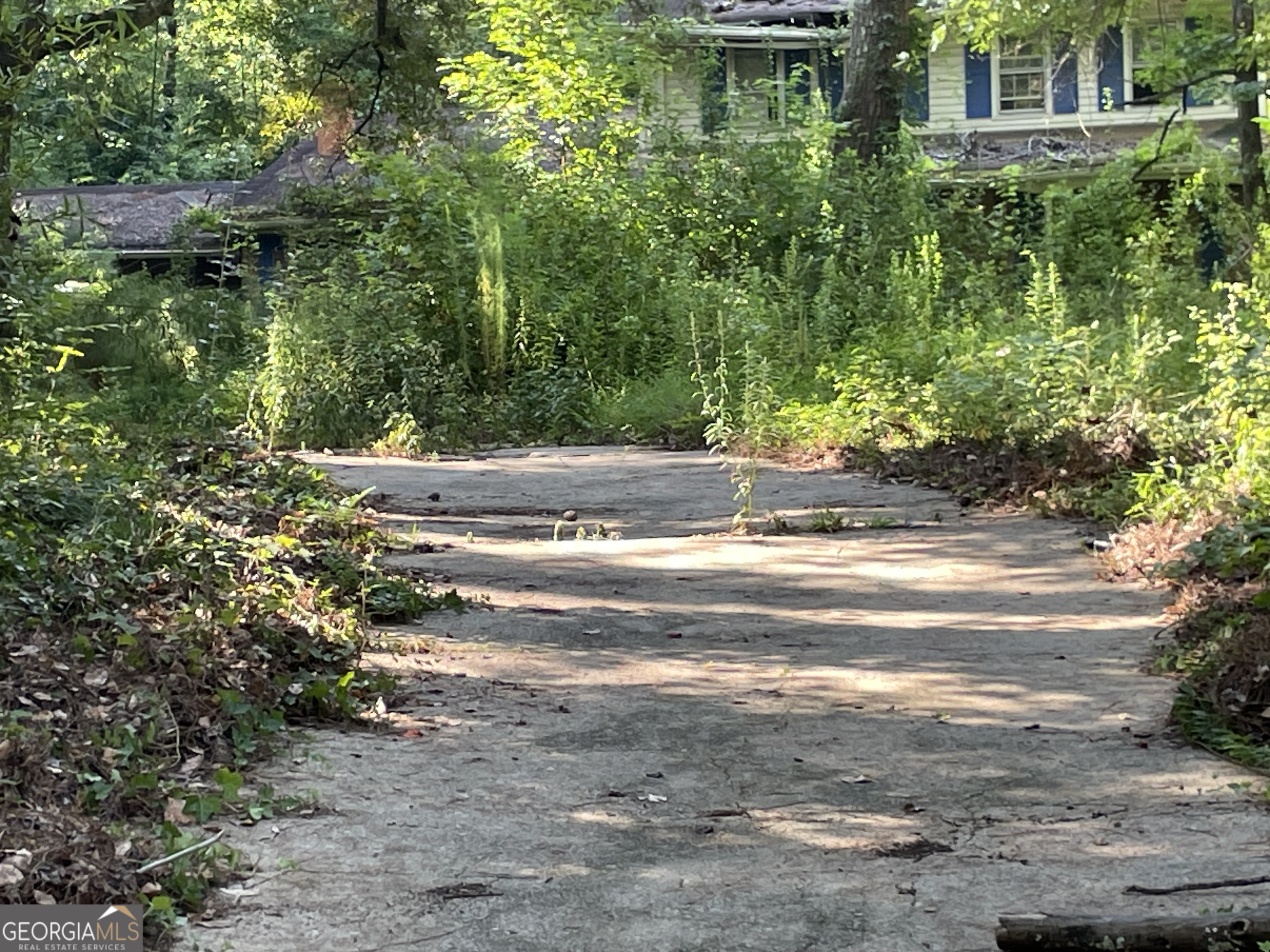 3311 Rowden Road Ellenwood, GA 30294 - Photo 4 of 6 a view of a house with a yard