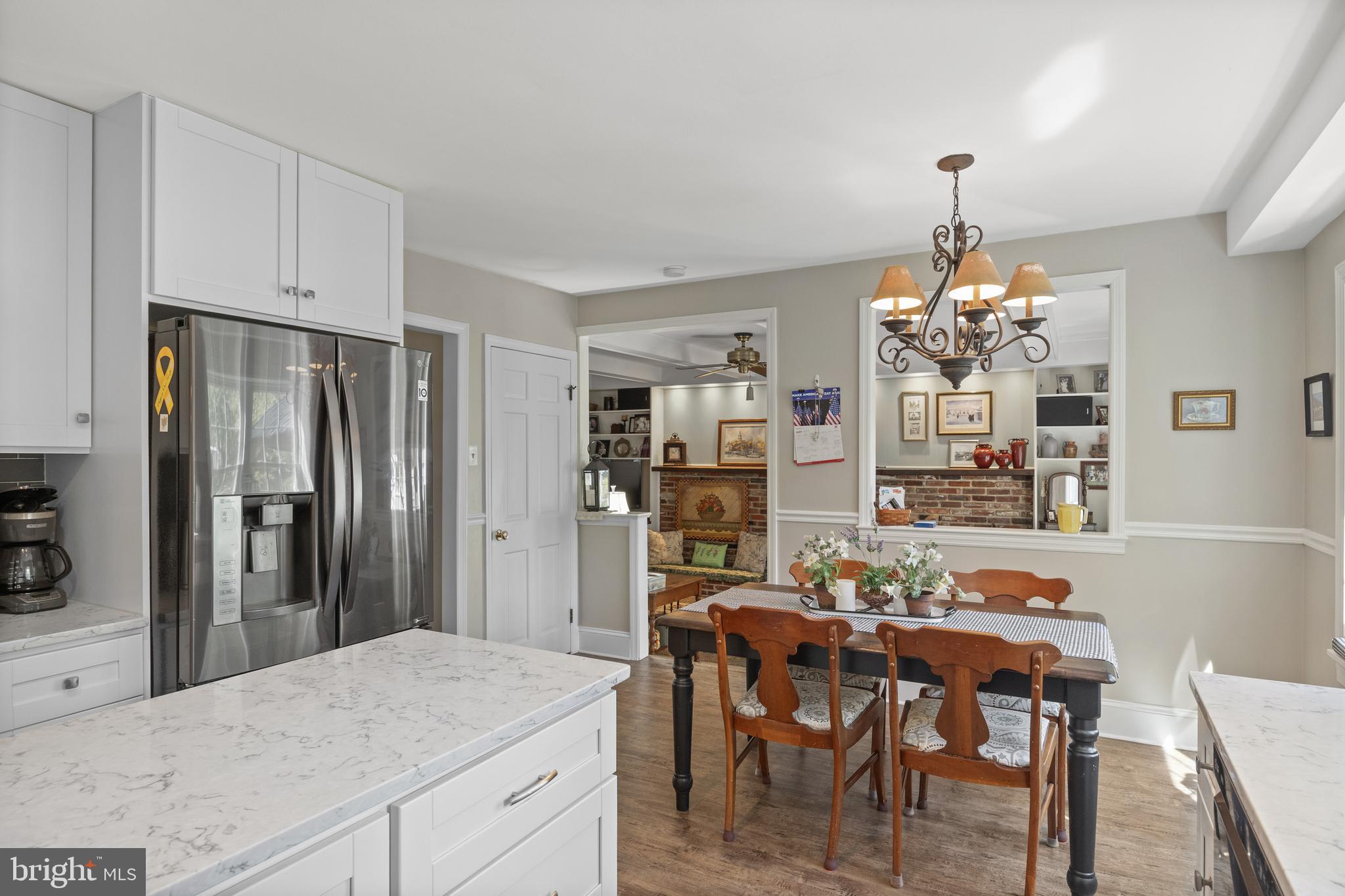 701 Decatur Drive Mount Laurel, NJ 08054 - Photo 12 of 36 a dining room filled chandelier and kitchen view