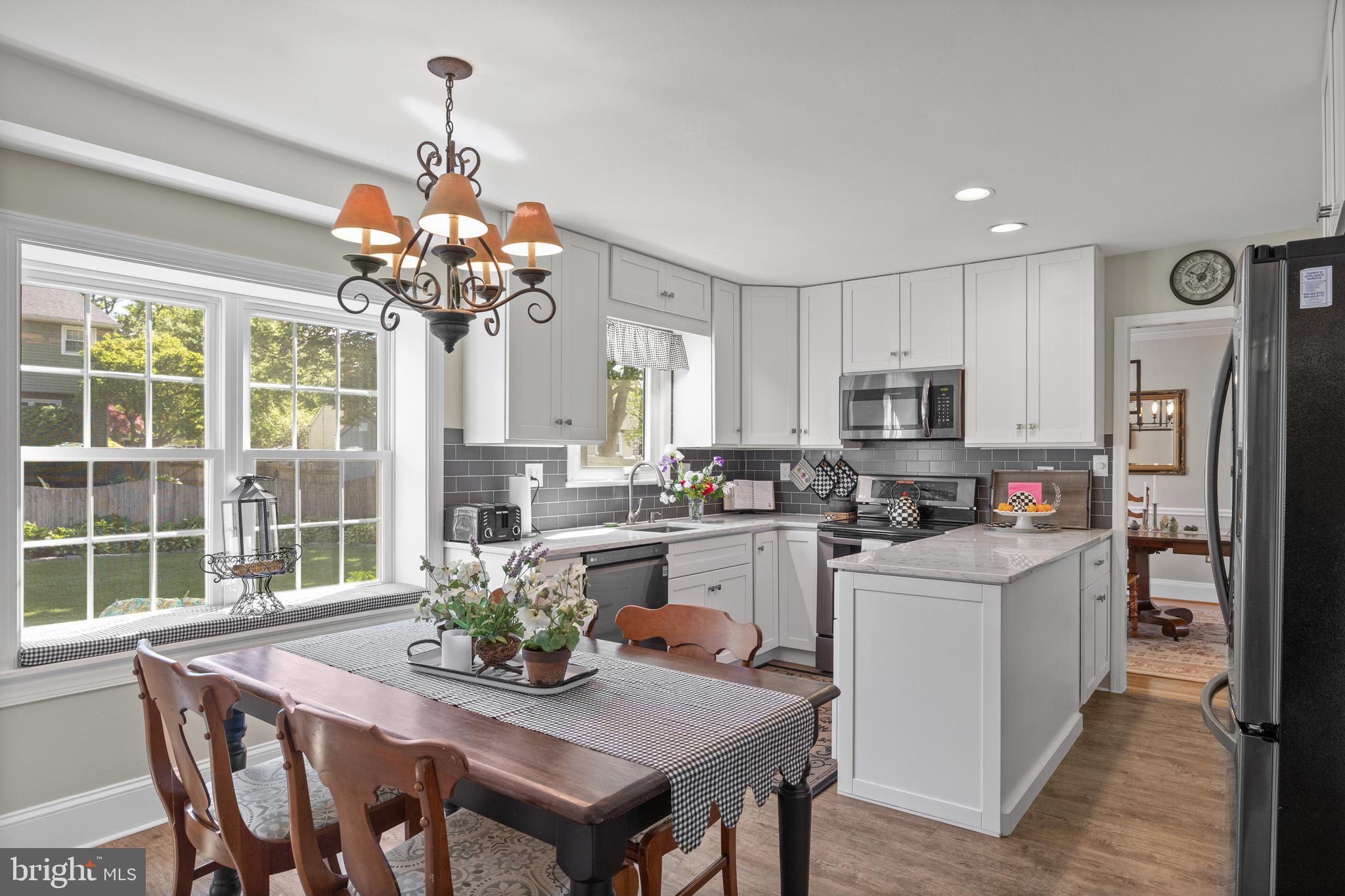 701 Decatur Drive Mount Laurel, NJ 08054 - Photo 13 of 36 a dining room filled a refrigerator and a chandelier