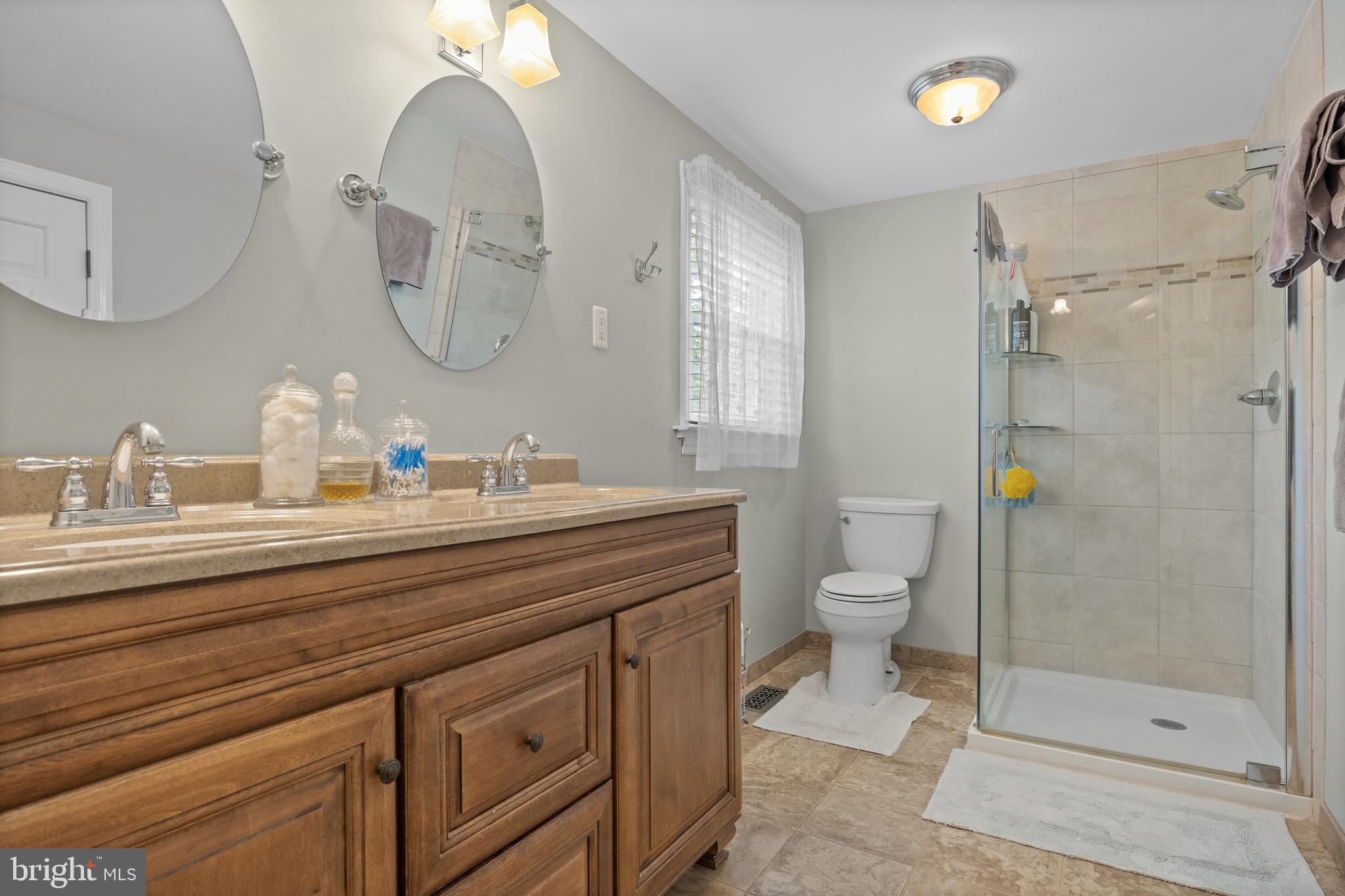 701 Decatur Drive Mount Laurel, NJ 08054 - Photo 23 of 36 a bathroom with a granite countertop toilet a sink and a mirror