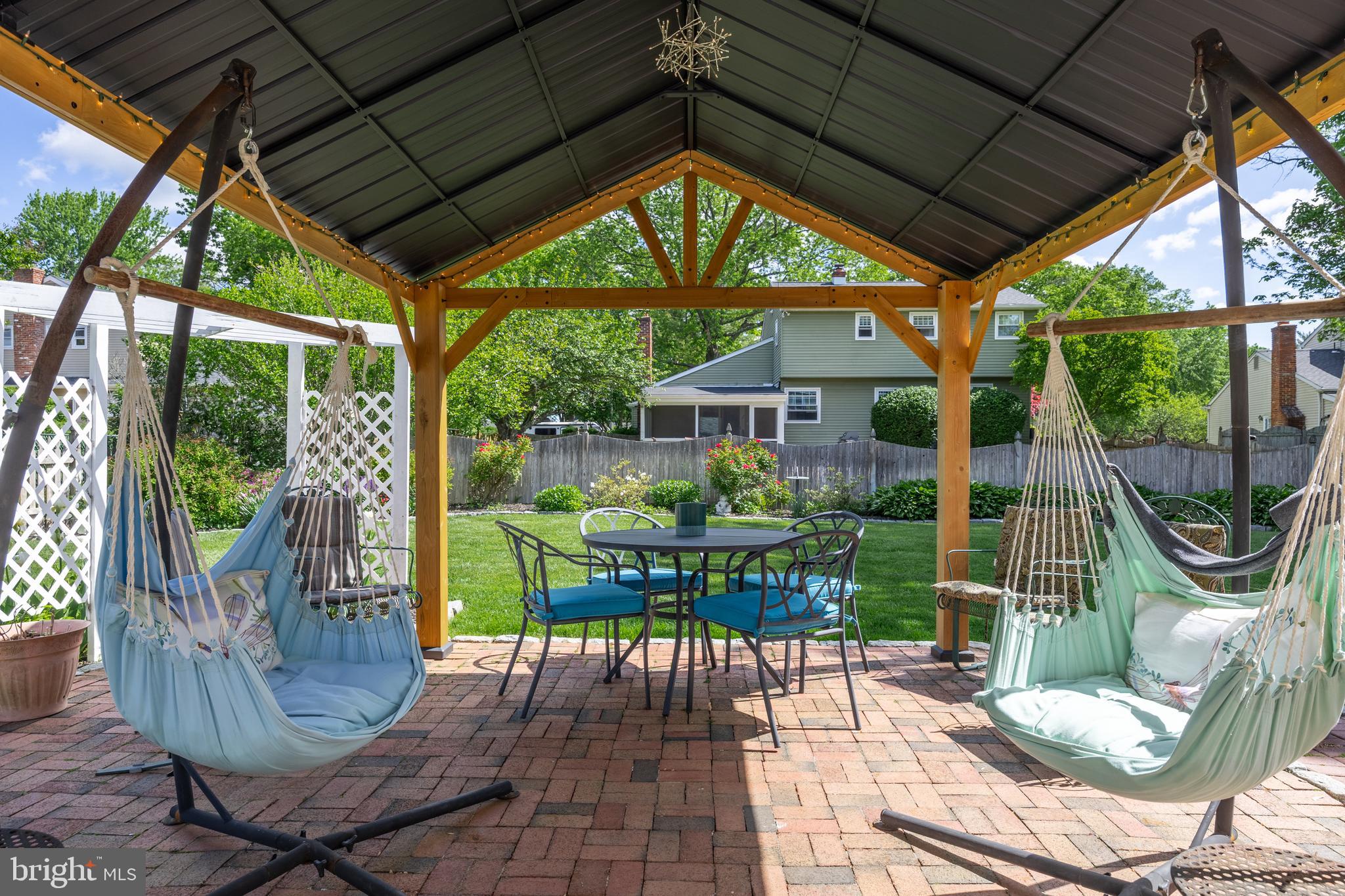 701 Decatur Drive Mount Laurel, NJ 08054 - Photo 32 of 36 a view of patio with table and chairs potted plants and floor to ceiling window