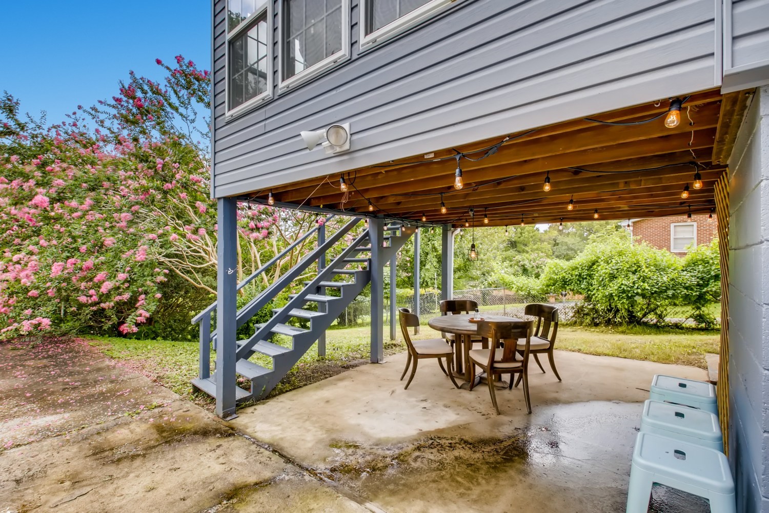 1005 A Mitchell Road Nashville, TN 37206 - Photo 20 of 23 a view of a patio with table and chairs potted plants and floor to ceiling window