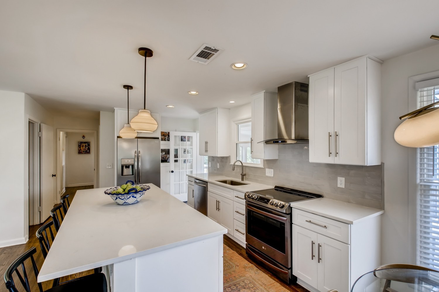 1005 A Mitchell Road Nashville, TN 37206 - Photo 6 of 23 a kitchen with a sink a stove and chairs