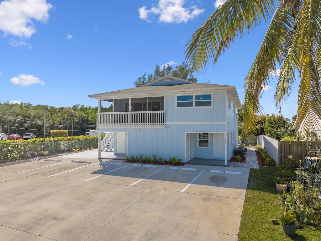 741 Hernando Street Fort Pierce, FL 34949 - Photo 2 of 36 a front view of a house with a garden