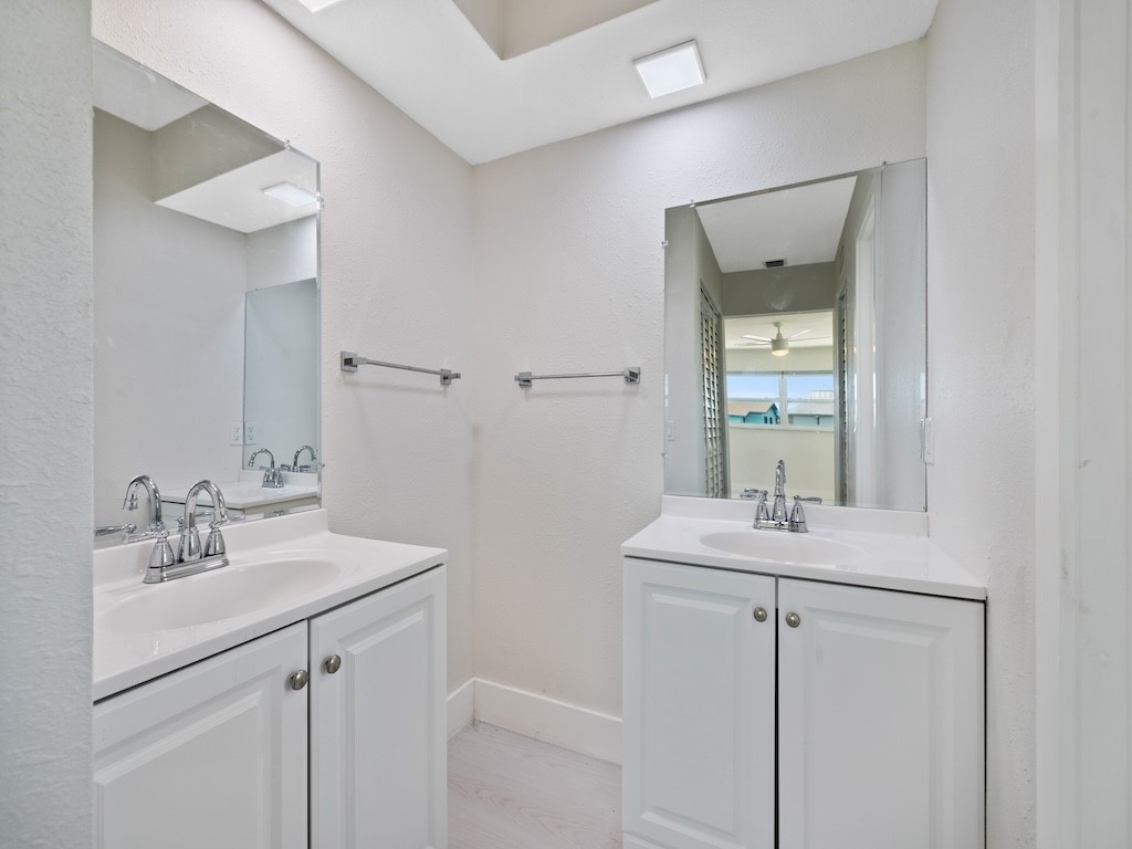 741 Hernando Street Fort Pierce, FL 34949 - Photo 24 of 36 a bathroom with a sink and a mirror