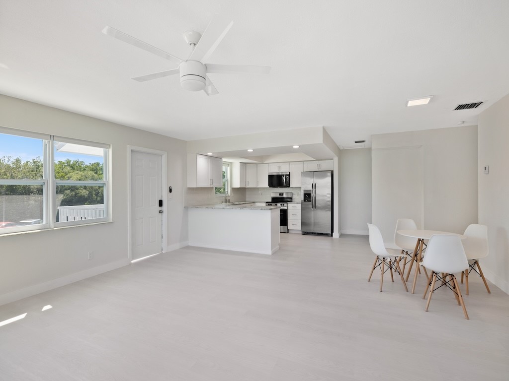 741 Hernando Street Fort Pierce, FL 34949 - Photo 35 of 36 a view of kitchen with furniture and large window