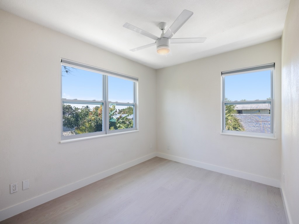 741 Hernando Street Fort Pierce, FL 34949 - Photo 7 of 36 an empty room with windows and closet